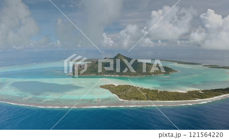 Scenic aerial perspective of Maupiti island in French Polynesia, stunning turquoise lagoon, vibrant coral reefs, mount Teurafaatui against cloudy sky. Remote wild nature paradise, exotic summer travel 121564220
