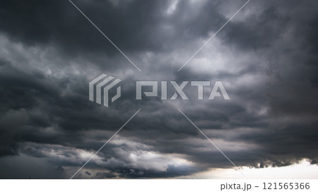 The dark sky with heavy clouds converging and a violent storm before the rain.Bad or moody weather sky and environment. carbon dioxide emissions, greenhouse effect, global warming, climate change The dark sky with heavy clouds converging and a violent storm before the rain.Bad or moody weather sky and environment. carbon dioxide emissions, greenhouse effect, global warming, climate change 121565366