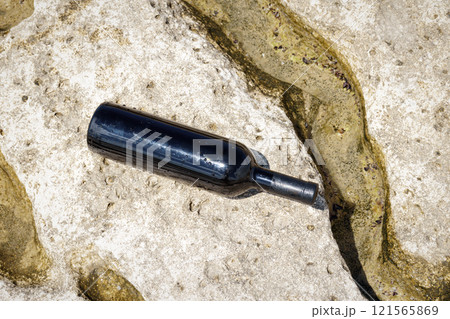 Bottle of wine on the shore. Bottle of wine on the shore. 121565869