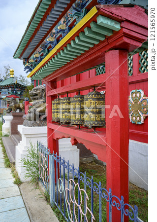 Buddhist prayer drums with mantras in Buddhist Monastery in Ivolginsky Datsan in Buryatia, Russia 121565970