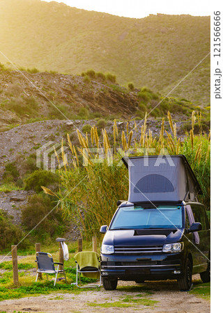 Camper van with roof top tent camp on nature 121566666