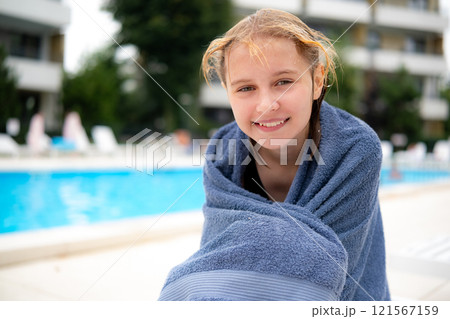 Cute Girl Sitting The Swimming Hotel Pool, Wrapped In A Towel Cute Girl Sitting The Swimming Hotel Pool, Wrapped In A Towel 121567159