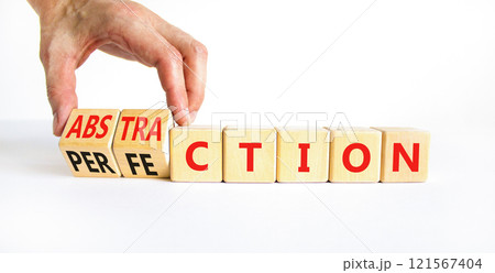 Perfection or abstraction symbol. Concept words Perfection Abstraction on beautiful wooden blocks. Beautiful white background. Businessman hand. Business perfection or abstraction concept. Copy space 121567404