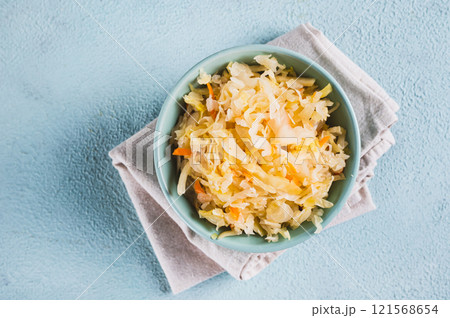 Close up of pickled sauerkraut with carrots in a bowl on the table top view 121568654