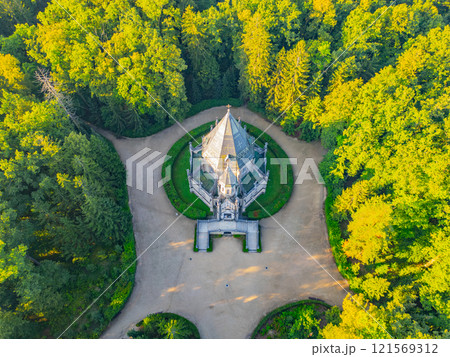 The impressive Schwarzenberg Tomb stands majestically amidst verdant trees in Domanin, near Trebon, Czechia, showcasing intricate architecture and a serene landscape that captures the essence of the 121569312