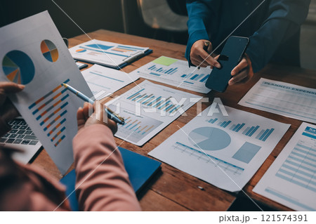 Business meetings to analyze investment strategies and brainstorm sales plans for a more profitable business. 121574391