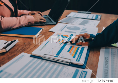 Business meetings to analyze investment strategies and brainstorm sales plans for a more profitable business. 121574401