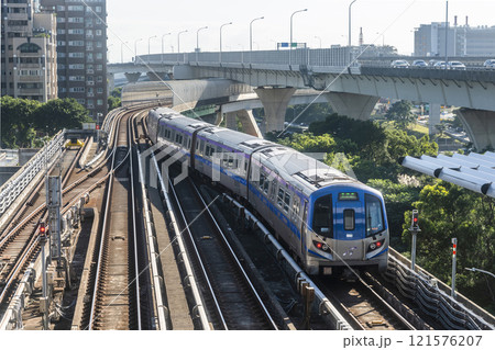 View of a Taoyuan International Airport line train running on the elevated track of the Taoyuan Mass Rapid Transit System. 121576207