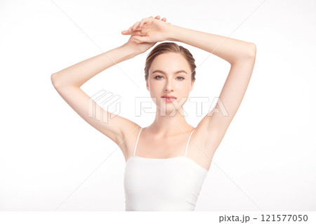 Beautiful Young woman lifting hands up to show off clean and hygienic armpits or underarms on white background, Smooth armpit cleanliness and protection concept Beautiful Young woman lifting hands up to show off clean and hygienic armpits or underarms on white background, Smooth armpit cleanliness and protection concept 121577050