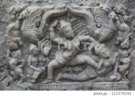 Decorative engraving of ancient tribes on a rock in the Danish zoo 121578191
