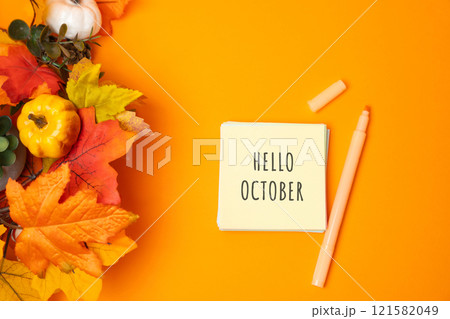 Notes with words Hello october and fall leaves. Concept of beginning of autumn and new season 121582049