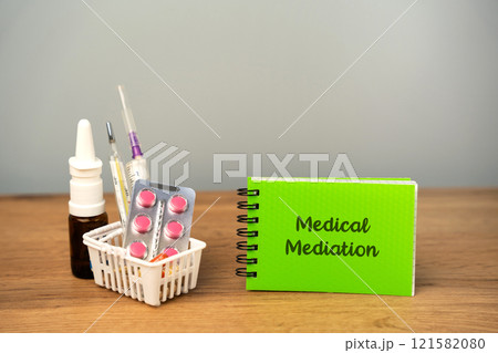 Medical mediation concept. Process where a neutral third party helps resolve conflicts or disputes related to healthcare. Trolley with medicines and a notebook Medical mediation concept. Process where a neutral third party helps resolve conflicts or disputes related to healthcare. Trolley with medicines and a notebook 121582080