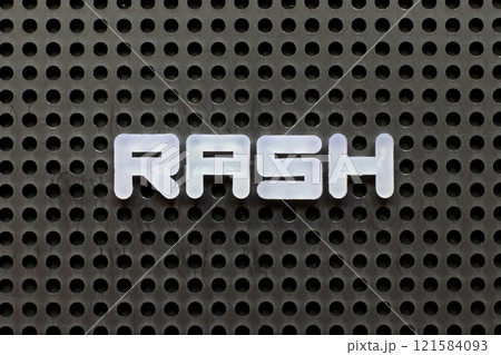 White color letter in word rash on black pegboard background 121584093