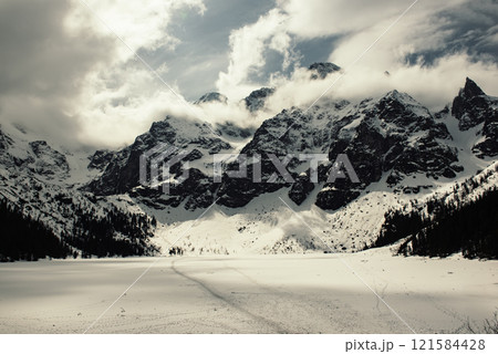 Frozen Lake Morskie Oko or Sea Eye Lake in Poland at Winter. Frozen Lake Morskie Oko or Sea Eye Lake in Poland at Winter. 121584428