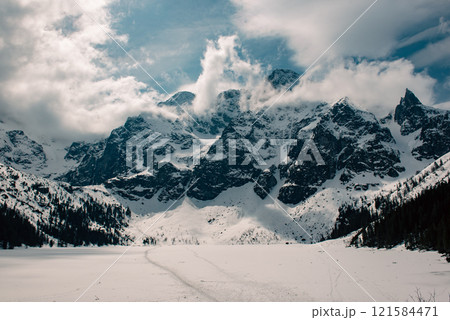 Frozen Lake Morskie Oko or Sea Eye Lake in Poland at Winter. Frozen Lake Morskie Oko or Sea Eye Lake in Poland at Winter. 121584471