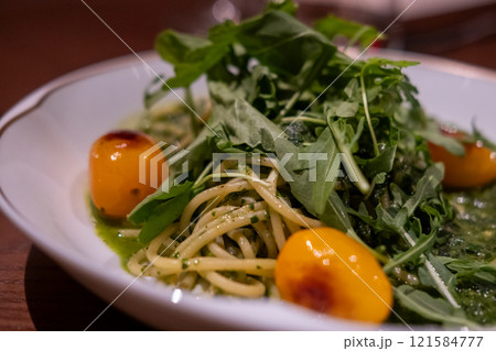 Pesto Spaghetti served on plate in the restaurant 121584777