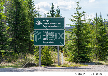 Jasper, Alberta, Canada - June 2 2021 : Road sign of Wapiti Campground in Jasper National Park. Jasper, Alberta, Canada - June 2 2021 : Road sign of Wapiti Campground in Jasper National Park. 121584809