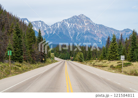 Jasper, Alberta, Canada - June 2 2021 : Icefields Parkway (Alberta Highway 93), Jasper National Park. Pyramid Mountain in the background. Jasper, Alberta, Canada - June 2 2021 : Icefields Parkway (Alberta Highway 93), Jasper National Park. Pyramid Mountain in the background. 121584811