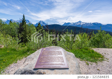Jasper, Alberta, Canada - June 2 2021 : David Thompson historical marker at Athabasca Pass Lookout in Jasper National Park. Canadian Rockies summer landscape. Jasper, Alberta, Canada - June 2 2021 : David Thompson historical marker at Athabasca Pass Lookout in Jasper National Park. Canadian Rockies summer landscape. 121584835