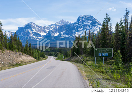 Road sign to Athabasca Falls on Icefields Parkway (Alberta Highway 93) in Jasper National Park, Alberta, Canada. Canadian Rockies summer landscape. Mount Fryatt and Geraldine Peak in the background. 121584846