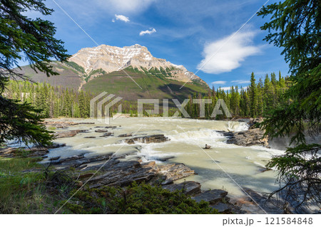 Athabasca river in Jasper National Park, Alberta, Canada. Canadian Rockies summer landscape. Mount Kerkeslin in the background. Athabasca river in Jasper National Park, Alberta, Canada. Canadian Rockies summer landscape. Mount Kerkeslin in the background. 121584848