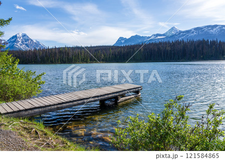 Wooden dock on the lake shore. Leach Lake, Jasper National Park. Alberta, Canada. Canadian Rockies summer landscape. 121584865