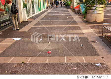 City street full of garbage and old paper. City street full of garbage and old paper. 121584887