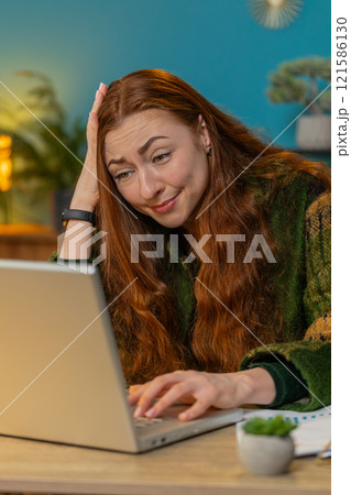 Frustrated business woman having software problems with laptop error or mistake virus notification 121586130