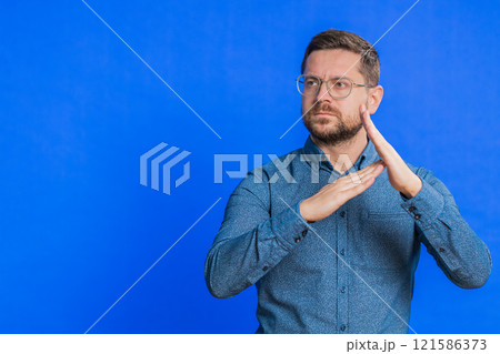 Tired upset man showing pause gesture, limit or stop sign, time out, take a break relax, rest 121586373