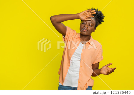 Black woman holding head, unsteady posture, dizzy expression, struggling with balance, weakness Black woman holding head, unsteady posture, dizzy expression, struggling with balance, weakness 121586440