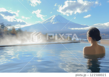 富士山と青空を見ながら温泉に入る若い女性の後ろ姿 121588021