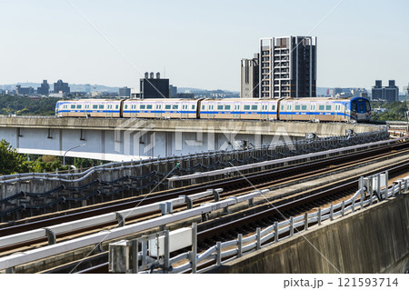 View of a Taoyuan International Airport line train running on the elevated track of the Taoyuan Mass Rapid Transit System. View of a Taoyuan International Airport line train running on the elevated track of the Taoyuan Mass Rapid Transit System. 121593714