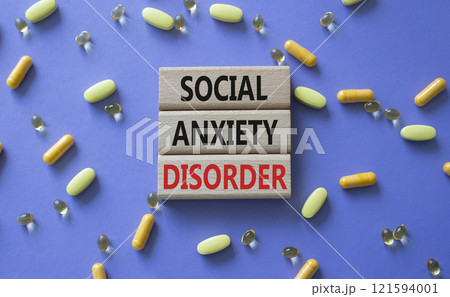 Social Anxiety Disorder symbol. Concept words Social Anxiety Disorder on wooden blocks. Beautiful purple background with pills. Healthcare and Social Anxiety Disorder concept. Copy space. Social Anxiety Disorder symbol. Concept words Social Anxiety Disorder on wooden blocks. Beautiful purple background with pills. Healthcare and Social Anxiety Disorder concept. Copy space. 121594001