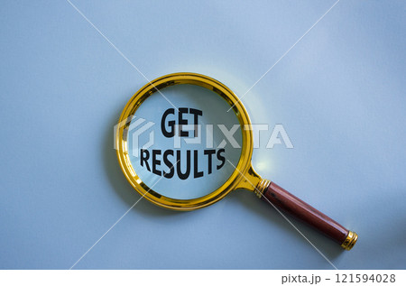 Get results symbol. Magnifying glass with words Get results. Beautiful blue background. Business and Get results concept. Copy space. 121594028