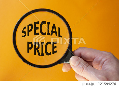 Special Price symbol. Magnifying Glass with Concept word Special Price. Businessman hand. Beautiful orange background. Business and Special Price concept. Copy space 121594276