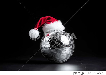 Disco ball in Santa's hat. Happy New Year and Christmas celebration concept, holiday party vibes, funny creative minimal photo 121595223