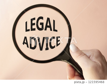 Legal advice symbol. Magnifying glass with words Legal advice. Businessman hand. Beautiful pink background. Business and Legal advice concept. Copy space. Legal advice symbol. Magnifying glass with words Legal advice. Businessman hand. Beautiful pink background. Business and Legal advice concept. Copy space. 121595468