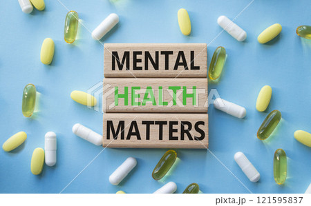 Mental Health Matters symbol. Concept words Mental Health Matters on wooden blocks. Beautiful blue background with pills. Healthcare and Mental Health Matters concept. Copy space. Mental Health Matters symbol. Concept words Mental Health Matters on wooden blocks. Beautiful blue background with pills. Healthcare and Mental Health Matters concept. Copy space. 121595837