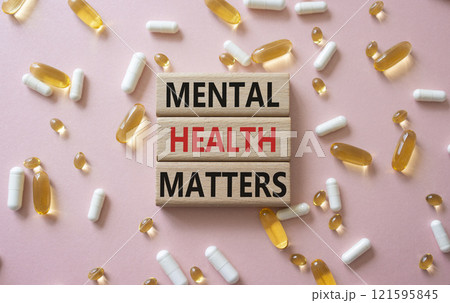 Mental Health Matters symbol. Concept words Mental Health Matters on wooden blocks. Beautiful pink background with pills. Healthcare and Mental Health Matters concept. Copy space. Mental Health Matters symbol. Concept words Mental Health Matters on wooden blocks. Beautiful pink background with pills. Healthcare and Mental Health Matters concept. Copy space. 121595845