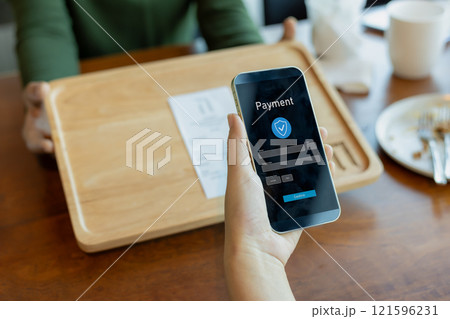 Payment online, Human hands holding mobile phone, Banking, Digital online payment concept, Technology online banking applications via internet network, Financial transaction, Pay without money. Payment online, Human hands holding mobile phone, Banking, Digital online payment concept, Technology online banking applications via internet network, Financial transaction, Pay without money. 121596231