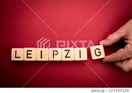 LEIPZIG. Word from wooden alphabet blocks on a red background 121597129