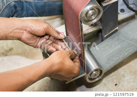 The metal deburring process by abrasive sand paper belt. The metal deburring process by abrasive sand paper belt. 121597519