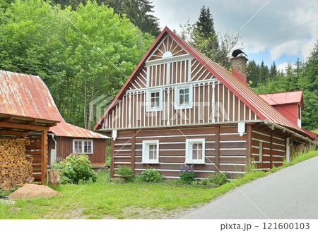Beautiful wooden cottage during summer Beautiful wooden cottage during summer 121600103