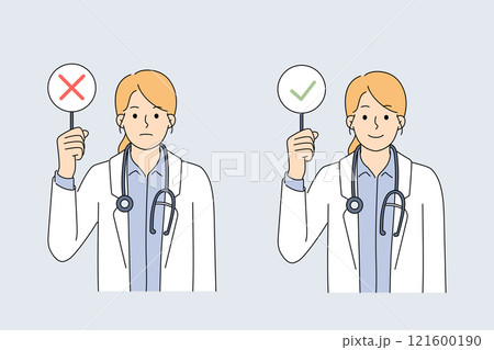 Woman doctor demonstrates sign with tick or cross, symbolizing permission or prohibition Woman doctor demonstrates sign with tick or cross, symbolizing permission or prohibition 121600190