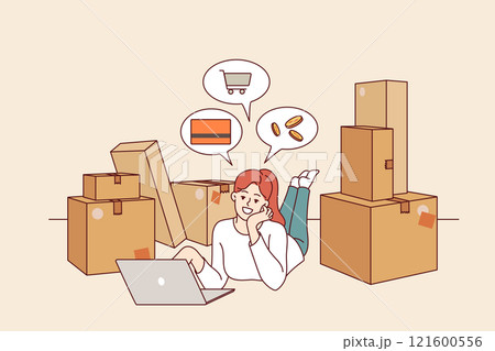 Woman owner online store is engaged in e-commerce, lying on floor with laptop among cardboard boxes Woman owner online store is engaged in e-commerce, lying on floor with laptop among cardboard boxes 121600556