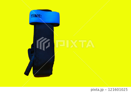 Medical tourniquet to stop bleeding. A device for slowing blood flow to the extremities, self-rescue, should be in everyone's first aid kit on yellow background 121601025
