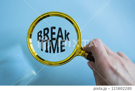 Break Time symbol. Magnifying Glass with Concept word Break Time. Beautiful blue background. Businessman hand. Business and Break Time concept. Copy space Break Time symbol. Magnifying Glass with Concept word Break Time. Beautiful blue background. Businessman hand. Business and Break Time concept. Copy space 121602280