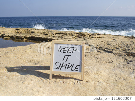Keep it Simple symbol. Concept words Keep it Simple on chalk white blackboard. Beautiful sea background. Business and Keep it Simple concept. Copy space. Keep it Simple symbol. Concept words Keep it Simple on chalk white blackboard. Beautiful sea background. Business and Keep it Simple concept. Copy space. 121603307