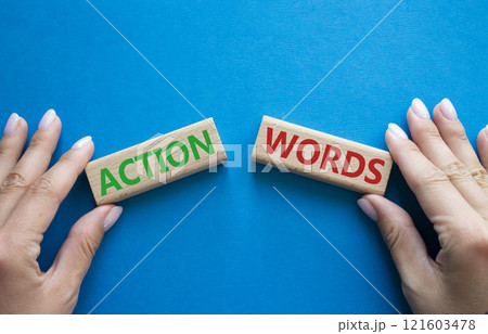 Action or words symbol. Concept word Action or words on wooden blocks. Businessman hand. Beautiful blue background. Business and Action or words concept. Copy space 121603478