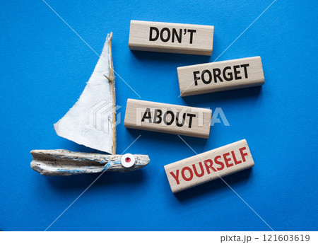 Do not forget about yourself symbol. Concept words Do not forget about yourself on wooden blocks with boat. Beautiful blue background. Business concept. Copy space 121603619